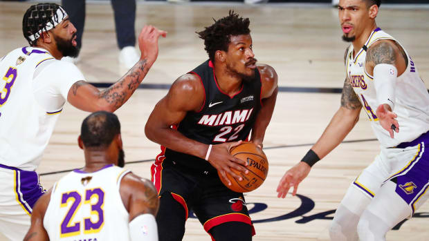 Miami Heat forward Jimmy Butler looks to shoot against Los Angeles Lakers guard Danny Green